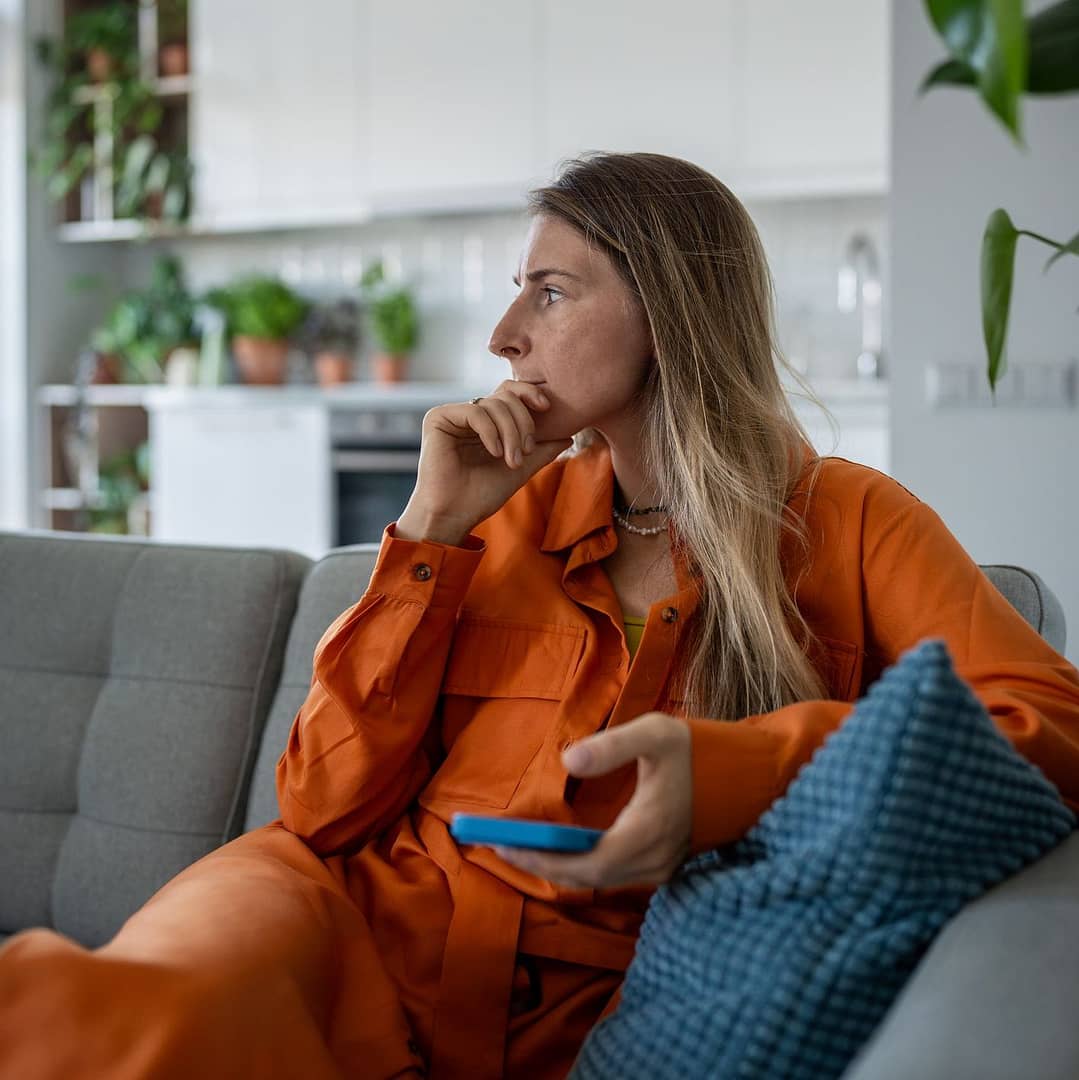 woman sitting on couch too self aware for therapy