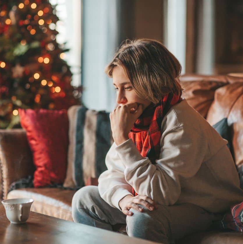 woman with holiday anxiety contemplating seeking help