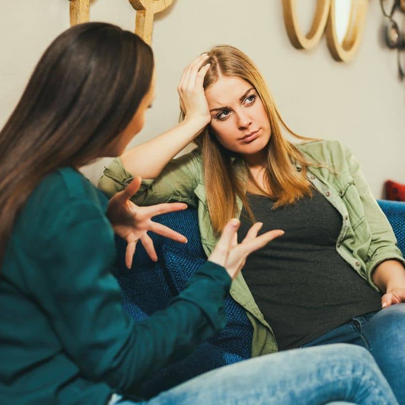 woman trauma dumping on friend, friend is getting frustrated